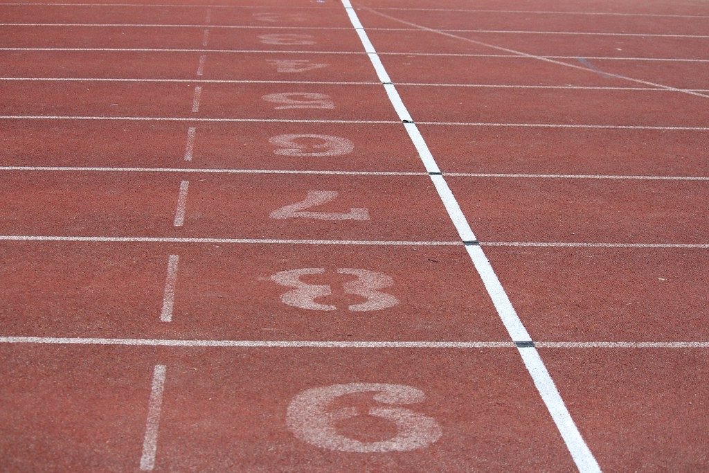Numbered lanes on a red running track